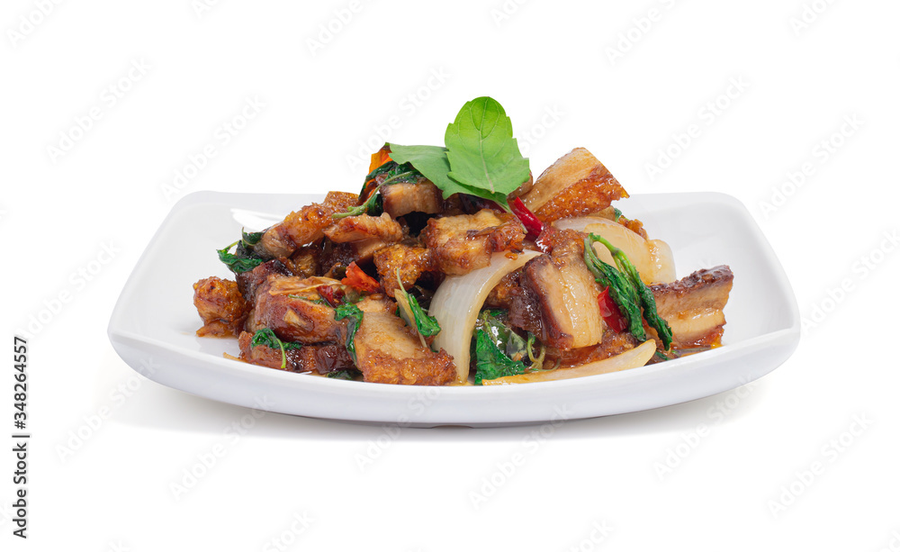 Stir-fried crispy pork belly and basil leaves isolated on white background with clipping path, Kao Pad Kra Prao Moo Krob. Popular food for Thai people. Stir-fried crispy pork belly and basil leaves isolated on white background with clipping path, Kao Pad Kra Prao Moo Krob. Popular food for Thai people.