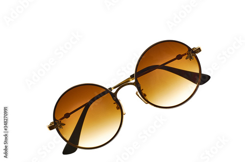 Round, female, with brown lenses, sunglasses on white isolated background.