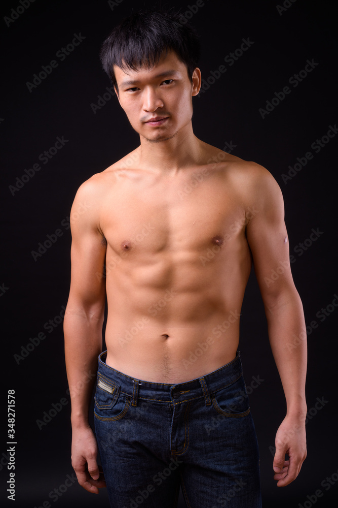 Portrait of young muscular Asian man shirtless Portrait of young muscular Asian man shirtless