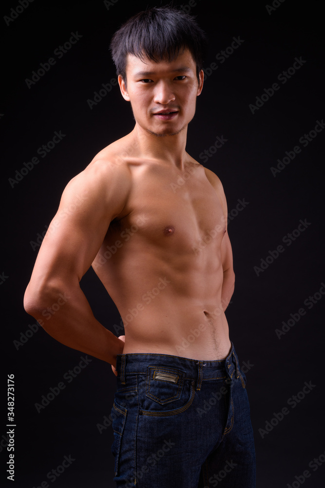 Portrait of young muscular Asian man shirtless Portrait of young muscular Asian man shirtless