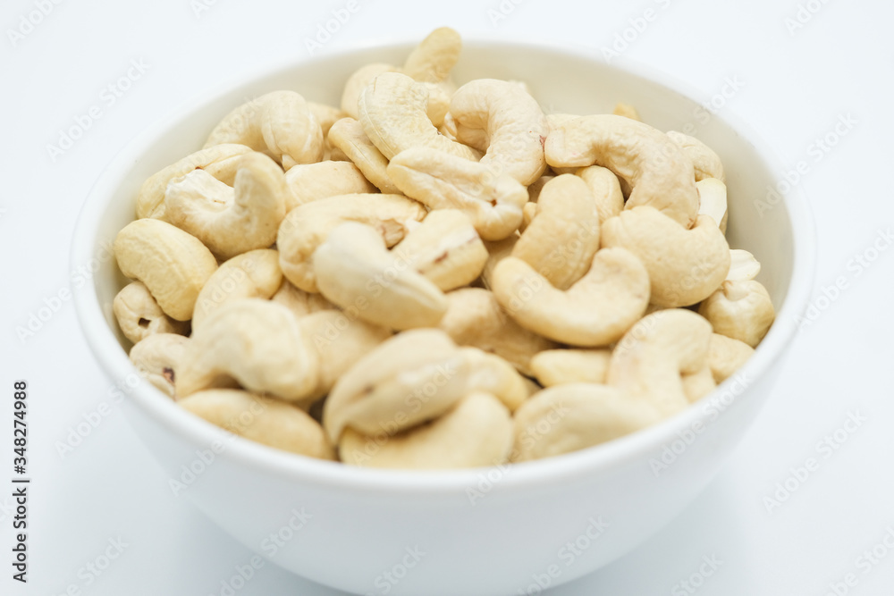 Cashew nut shot on a white isolated background. Cashew nut shot on a white isolated background.