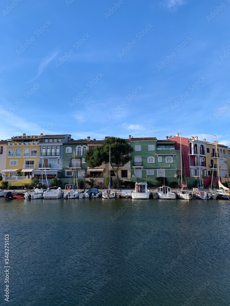 colorful houses and blue sky and yachts