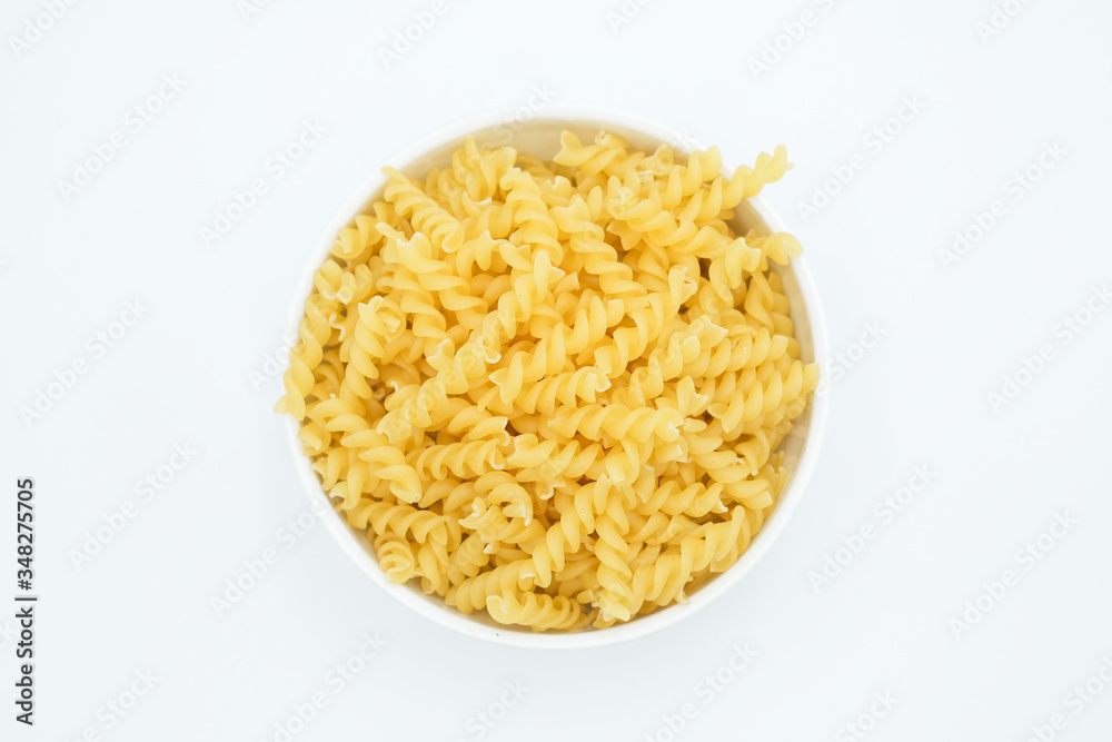 Twisted macaroni shot on a white isolated background. Twisted macaroni shot on a white isolated background.