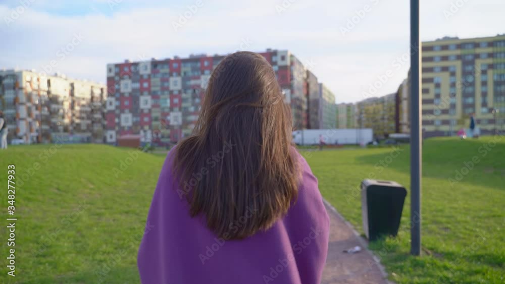 Lady turned, profile, gentle smile, looks in camera, half-sideways, beautiful eye. Sunny video of female walking in Park fresh air at sunset. Middle-aged brunette girl, wind blows long dark hair, Life Lady turned, profile, gentle smile, looks in camera, half-sideways, beautiful eye. Sunny video of female walking in Park fresh air at sunset. Middle-aged brunette girl, wind blows long dark hair, Life