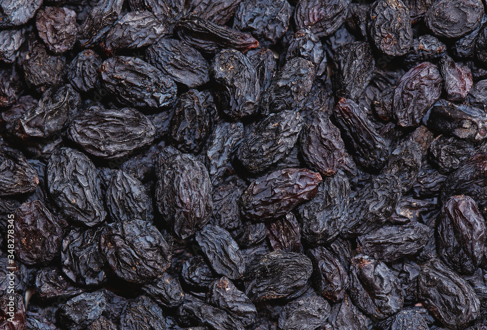 Background, dried black sultana grapes, raisins Background, dried black sultana grapes, raisins