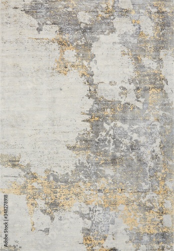 Abstract patterned modern rug texture in ivory gold photo