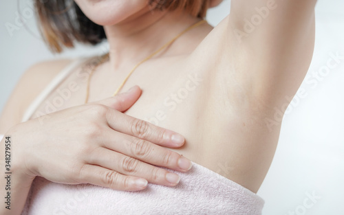 Wallpaper Mural Women lift arms to show beautiful underarm skin, using smooth armpit care products Torontodigital.ca