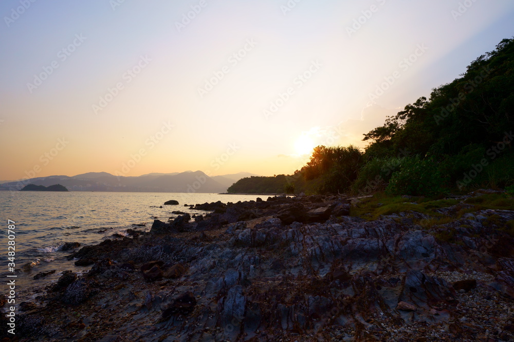 sunset at the coast. Sam Mun Tsai, Yim Tin Tsai, Tai Po, Hong Kong. Hong Kong UNESCO Global Geopark.