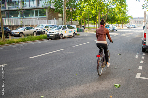 young woman riding a bike © Chouk