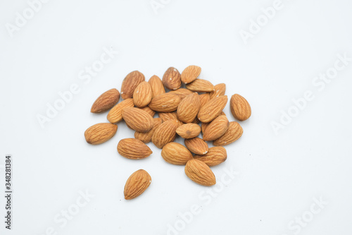 Badam or Almonds shot on a white isolated background.