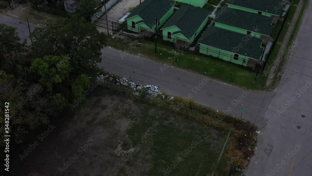 Trash in the street and a housing project, Houston, Texas, USA