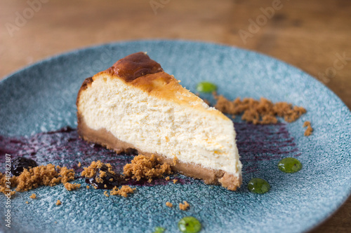 Piece of cheesecake with blueberry jam