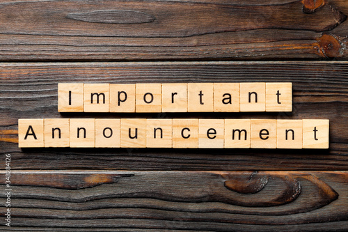 Slika na platnu Important announcement word written on wood block