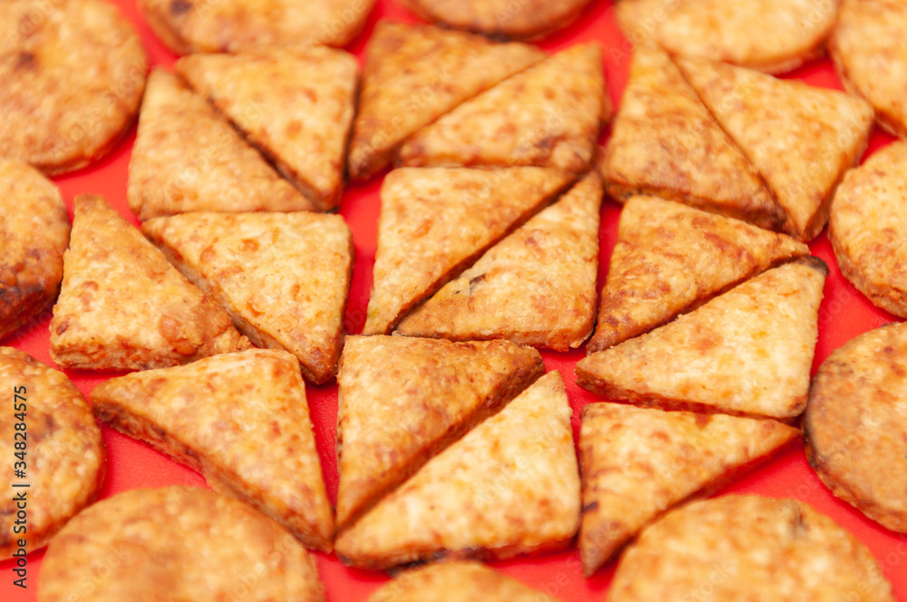 Rosy crackers on red background