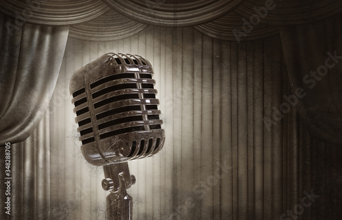 Фотография Old retro microphone on stage and curtain in the style of old photography