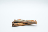 Cinnamon or Cinamon shot on a white isolated background.