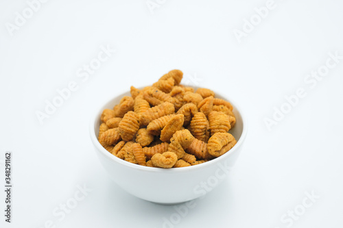 Kuih Siput , a malay traditional cuisine shot on a white isolated background.