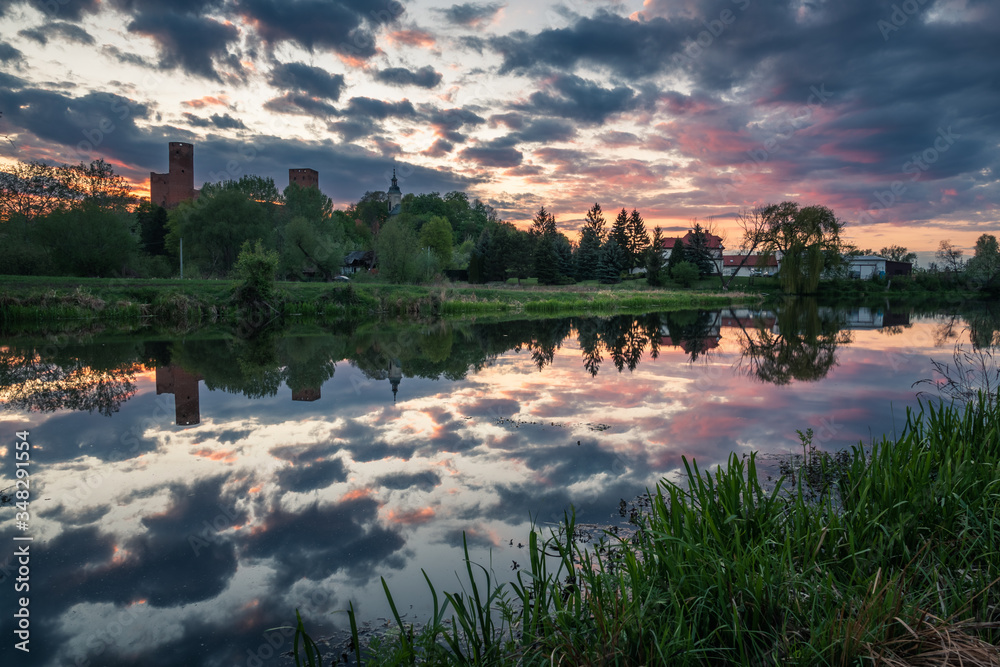 Castle and Czerskie lake at sunset in Czersk, Poland