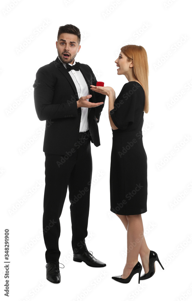 Young woman with engagement ring making marriage proposal to her boyfriend on white background Young woman with engagement ring making marriage proposal to her boyfriend on white background