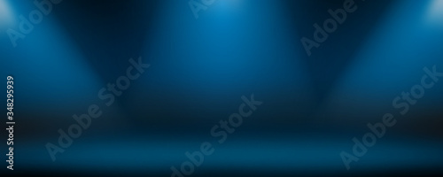 Dark blue background with white lamp lights. Template for product presentation. Studio with illuminated floor, wall. Empty space for the copy.