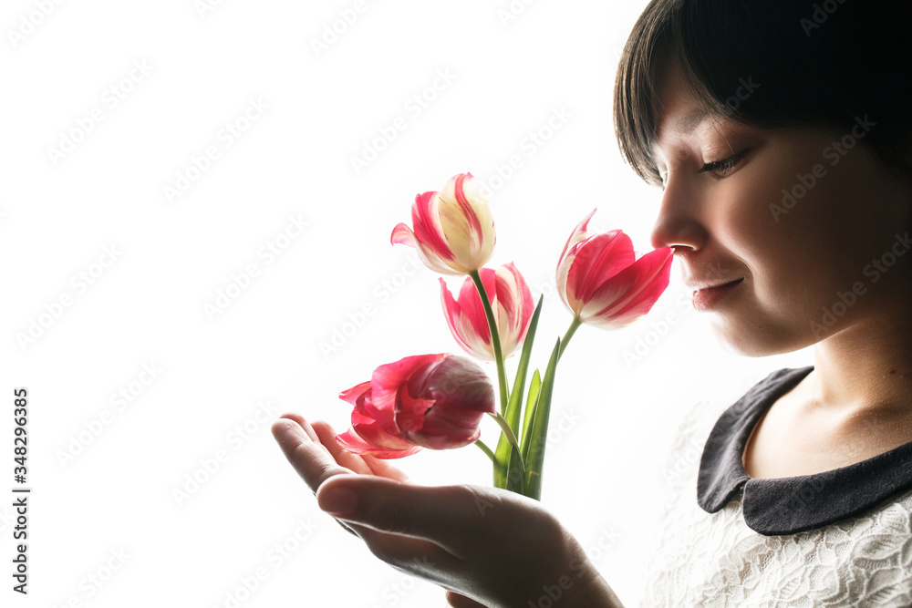 Girl with bouquet of tulips on isolated background