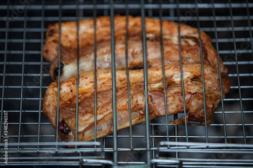 Two fried ribs on the grill, in the spring. B-B-Q