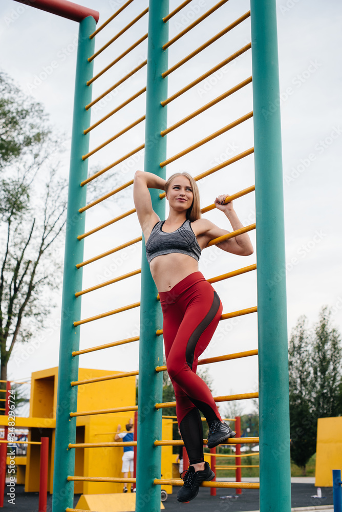 Sexy girl goes in for sports in the open air. Fitness. Healthy lifestyle