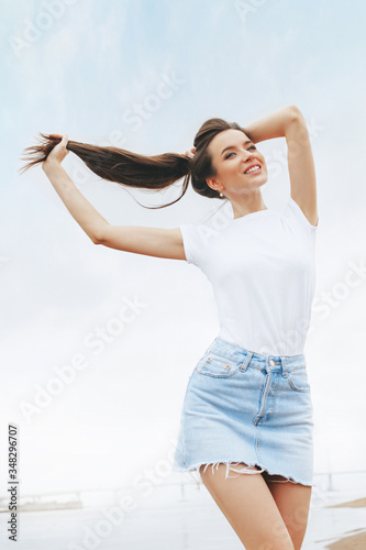 Young beautiful happy woman is relaxing on beach