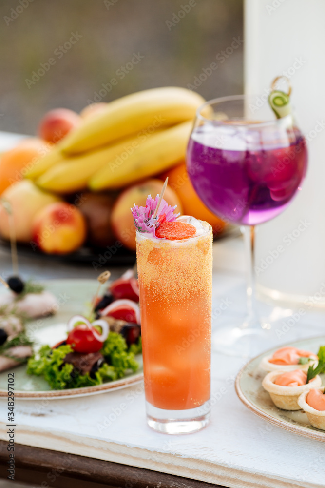 summer cocktails catering buffet with  and fruits on a white wooden table
