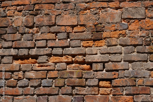 Old red brick wall texture background. Civil and industrial construction.
