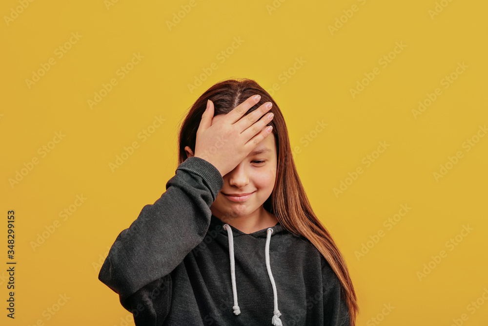 Stupid thing to do. Hand Gesture face. A hand on his forehead. Girl ridicules thing to do. Stupid thing to do. Hand Gesture face. A hand on his forehead. Girl ridicules thing to do.
