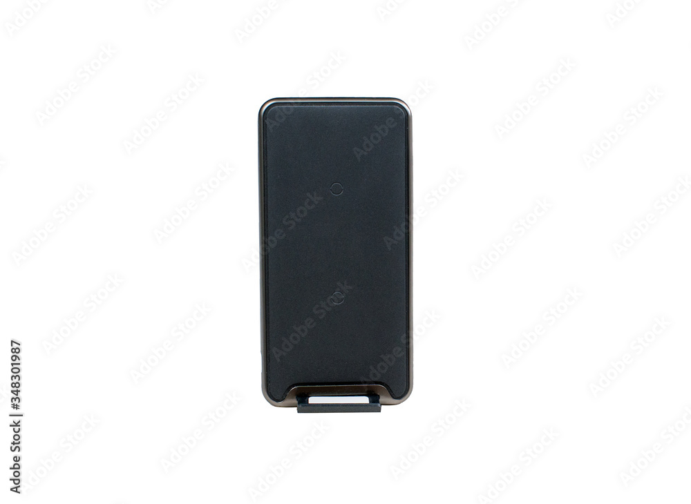 Black modern wireless charger stand pad for cellphone isolated on white bakcground. Black modern wireless charger stand pad for cellphone isolated on white bakcground.