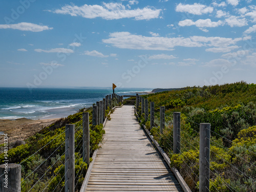 boardwalk near beach on sunny summer day seaside