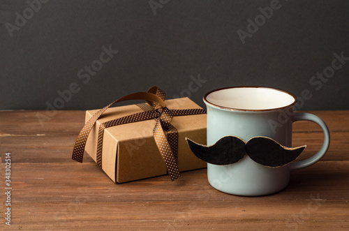 Father's day holiday concept background. Cup coffee and gift