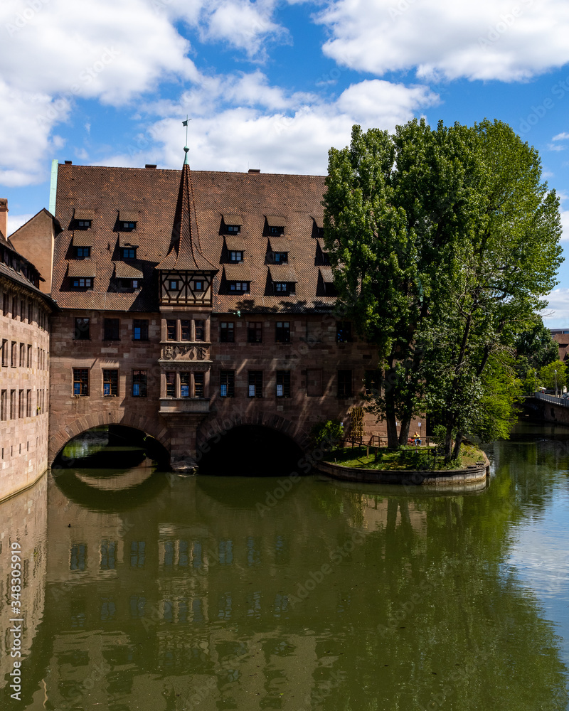Nuremberg, Bavaria / Germany - May 06, 2020. View from the Museumsbrücke which is a sandstone arch bridge over the Pegnitz river.