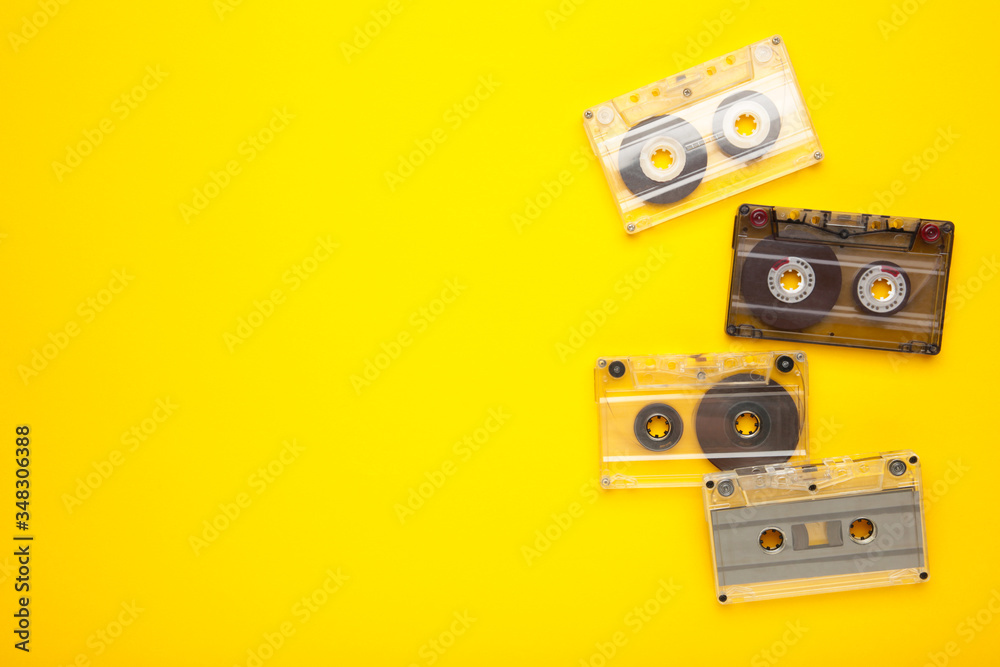 Inscription music day with old cassettes on a yellow background. Music day Inscription music day with old cassettes on a yellow background. Music day