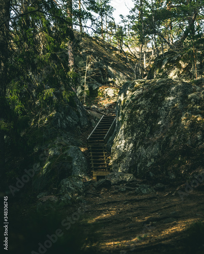 Wooden stairs going up the rock