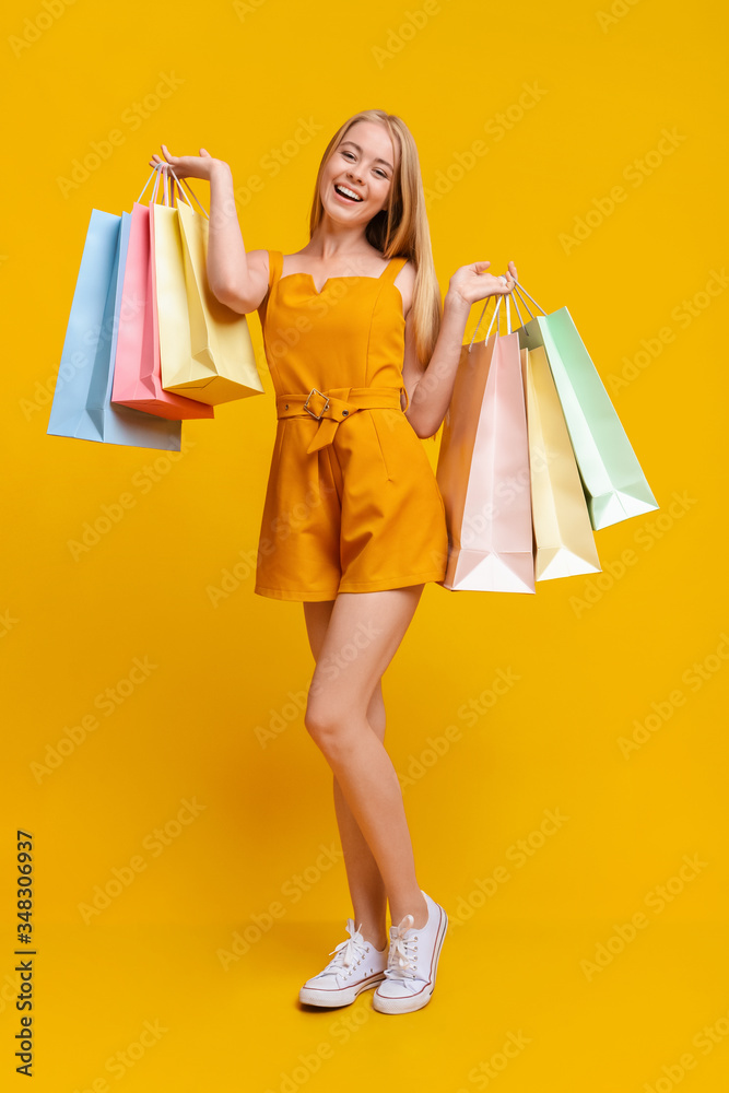 Teen Fashion. Pretty Young Girl With Lots Of Bright Shopping Bags