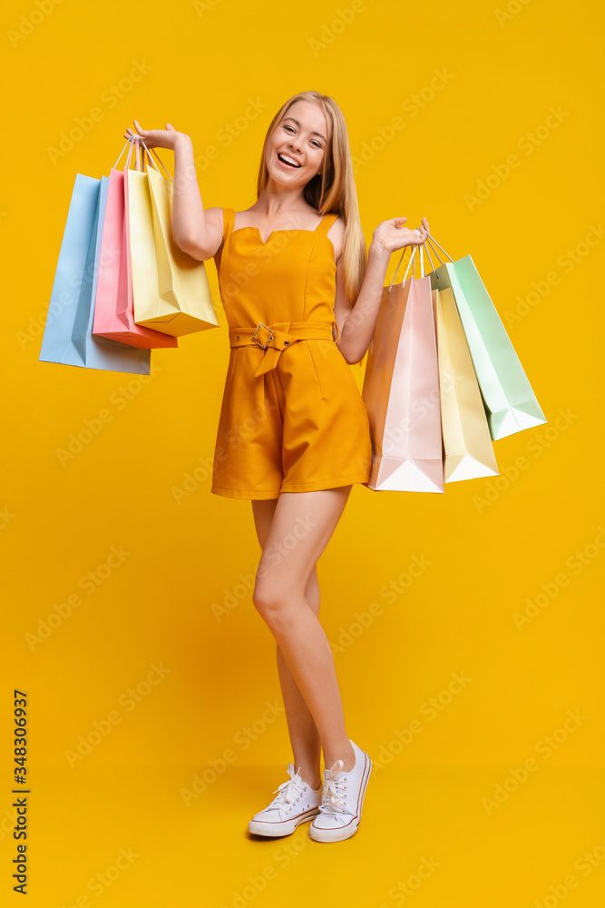 Teen Fashion. Pretty Young Girl With Lots Of Bright Shopping Bags Teen Fashion. Pretty Young Girl With Lots Of Bright Shopping Bags