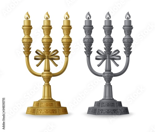 Golden and silver candelabrums with three candlesticks isolated on white background