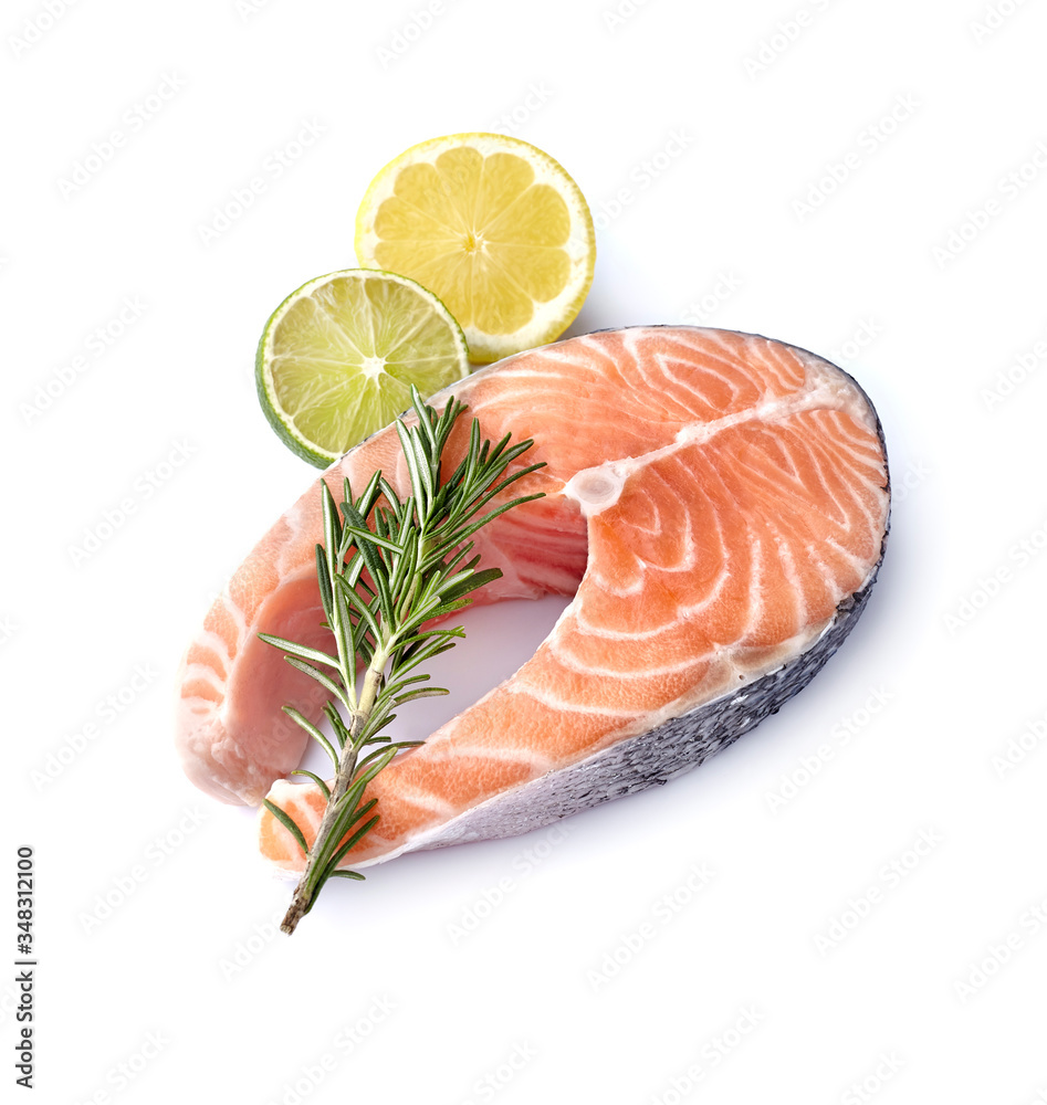 Salmon fish on white background with fresh rosemary and citrus fruits. Steak with lemon and lime isolated. Salmon fish on white background with fresh rosemary and citrus fruits. Steak with lemon and lime isolated.