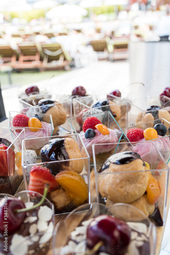 Candy bar food buffet by the pool, during hotel brunch, catering in the garden, food bloggers event