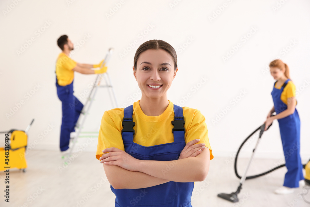 Professional janitor in uniform indoors. Cleaning service