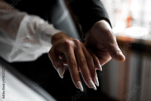 bride and groom holding hands   © Maksim