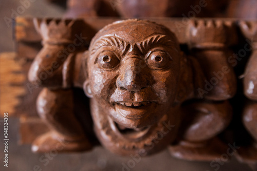 close up of a wooden statue face