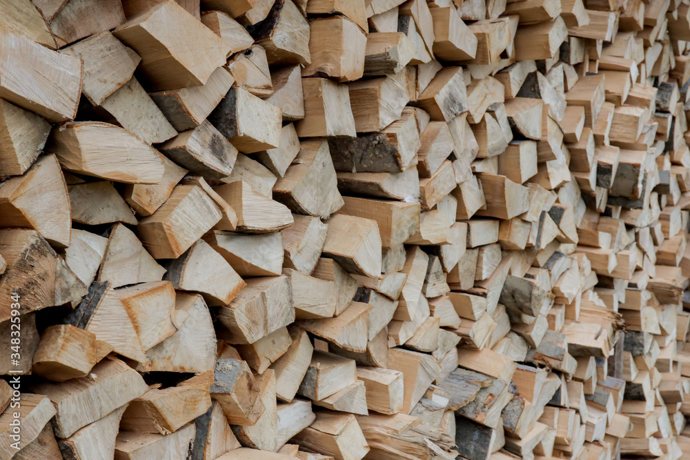 Stacks of Firewood. Preparation of firewood for the winter. Pile of Firewood.Firewood background Stacks of Firewood. Preparation of firewood for the winter. Pile of Firewood.Firewood background