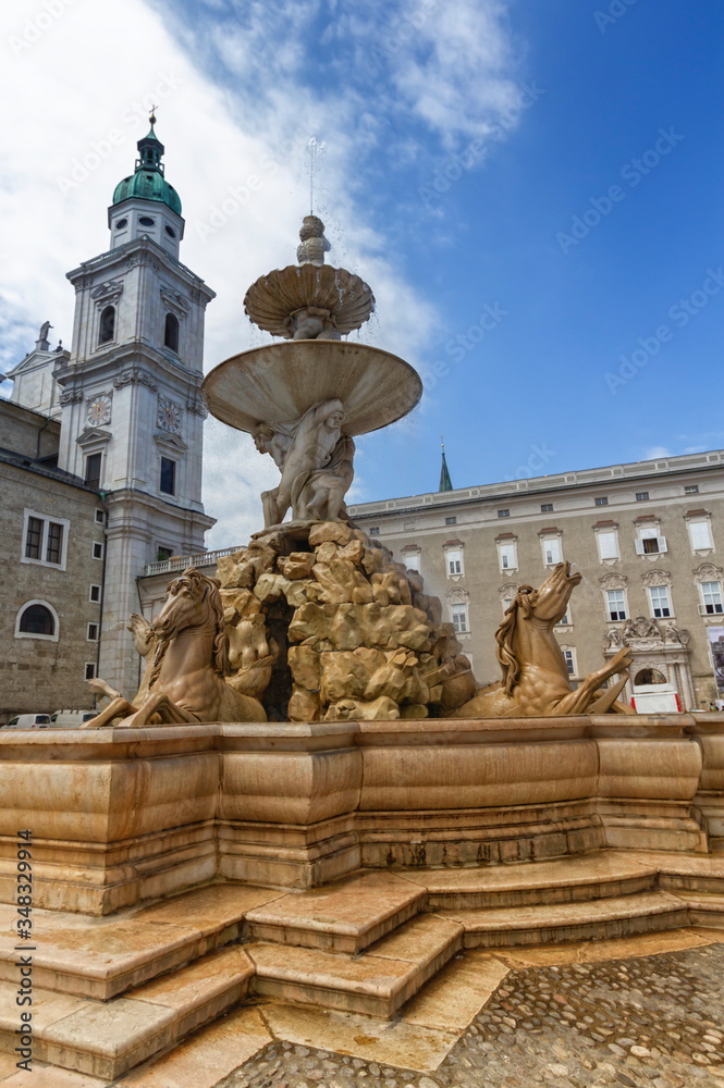 Horse fountain in front of Cathedral in the old town of Salzburg by day, Austria
