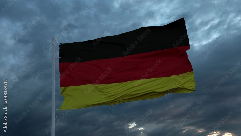 Realistic flag of Germany waving in the wind against deep heavy stormy sky Realistic flag of Germany waving in the wind against deep heavy stormy sky