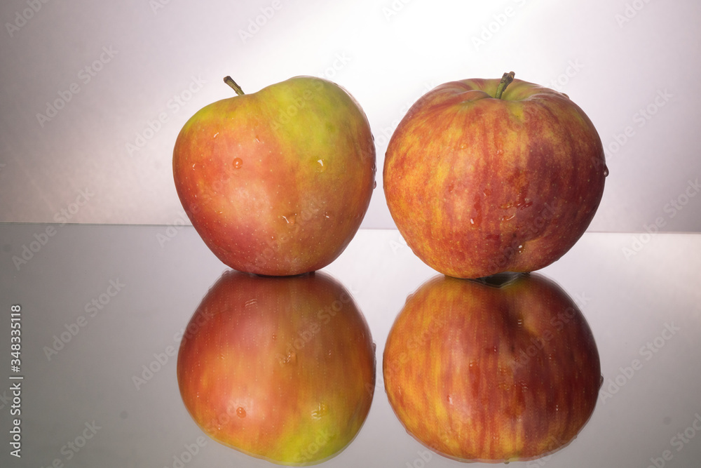 red apple on mirroring table. Gorizontal image with copy space. red apple on mirroring table. Gorizontal image with copy space.