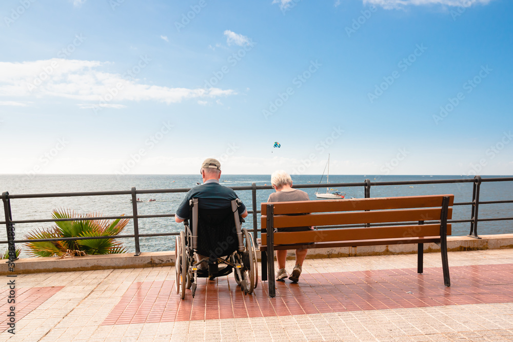 disabled person on a wheelchair on a sea vacation